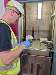A man servicing a lift