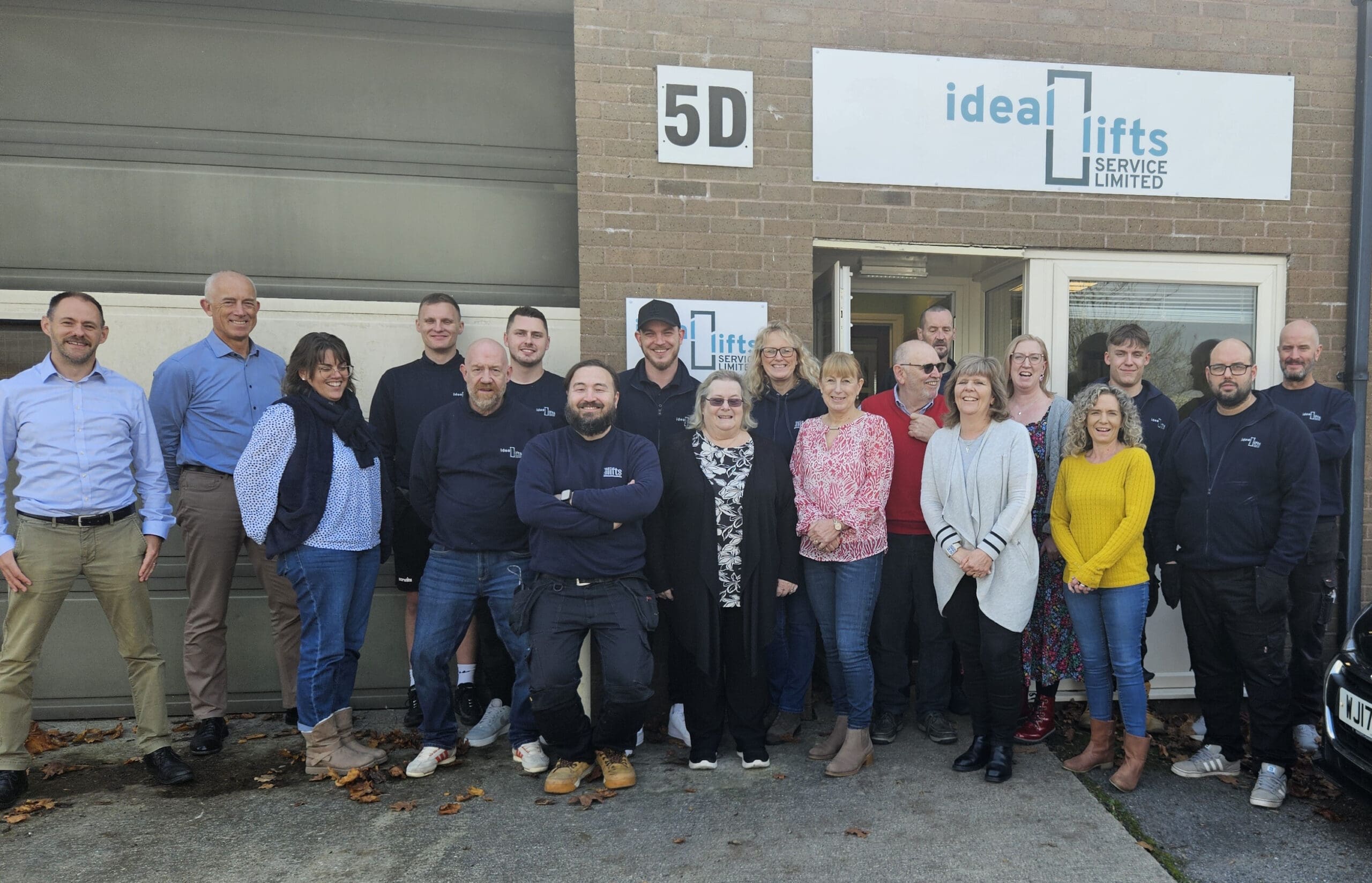 Ideal Lifts team photo in front of their office
