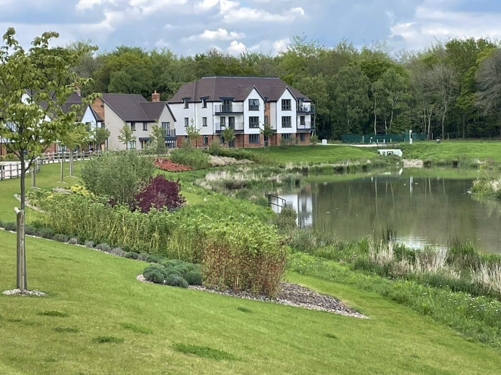 Luxury apartment building by a pond