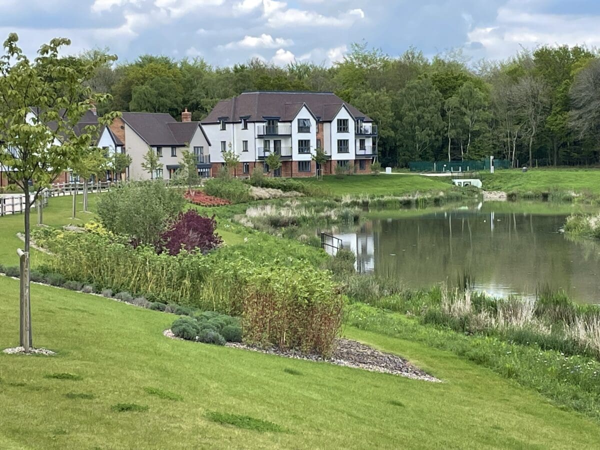 Luxury apartment building by a pond